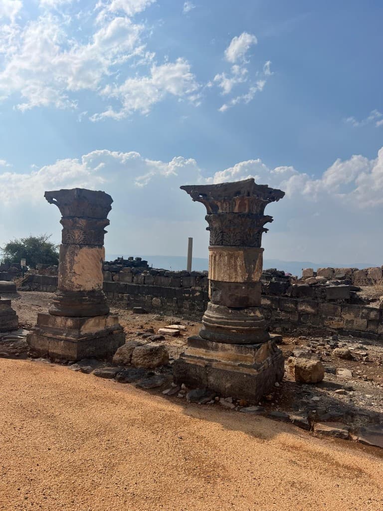 Two column capitals standing in the church ruins at Sussita